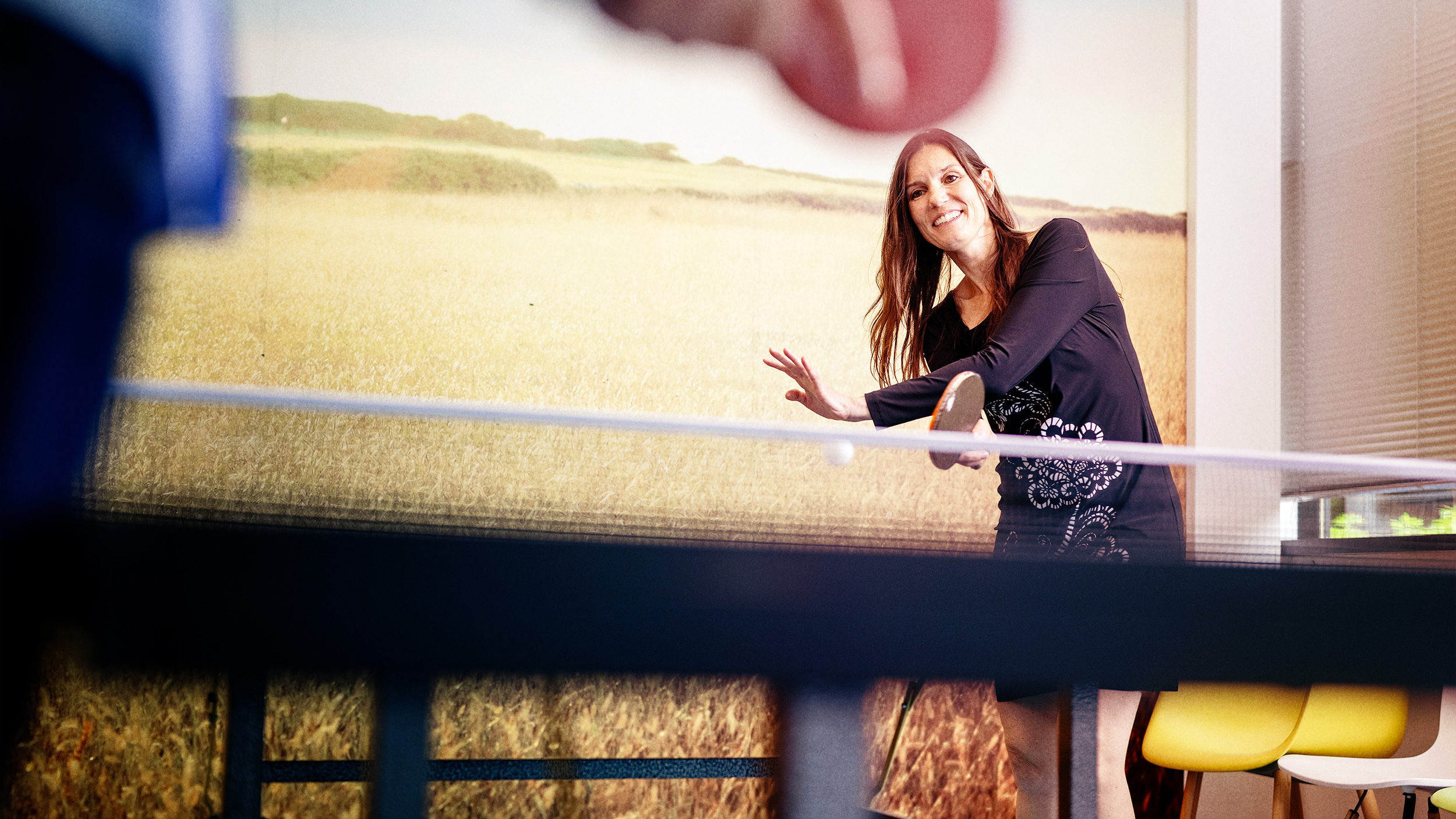 Two people talking in a kitchen