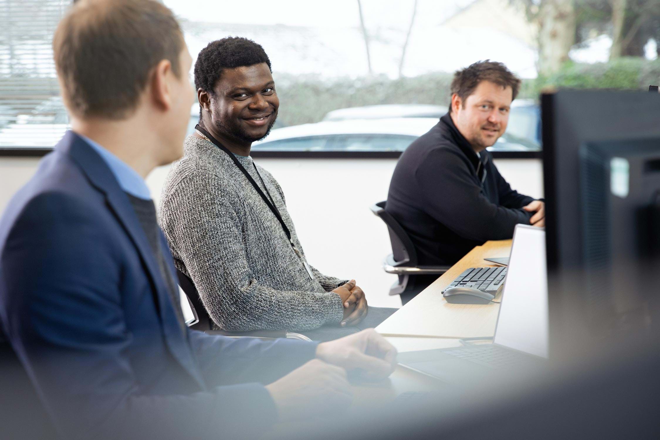 Three men working in IWF's tech team