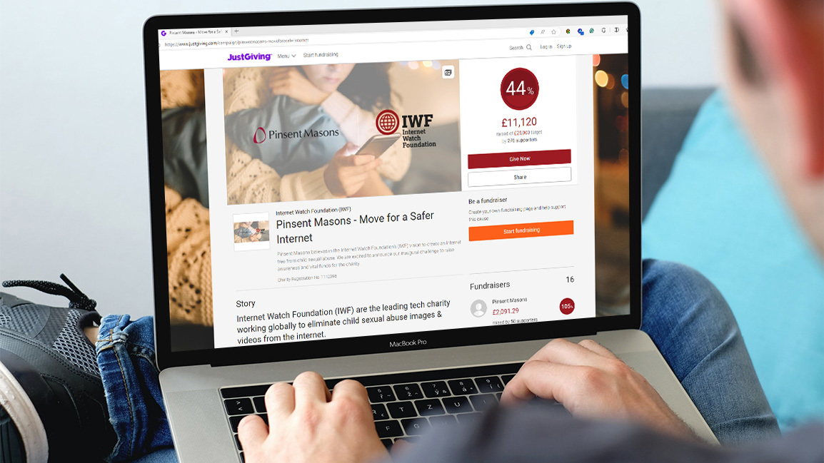 Man Typing on Laptop